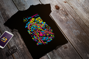A black tshirt with the multi-colored text "The Ablegamers Charity" in the top center. The central design includes a representation of 8-bit retro era game iconography.